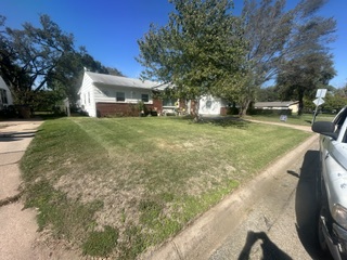 A freshly mowed front lawn in front of a Wichita home